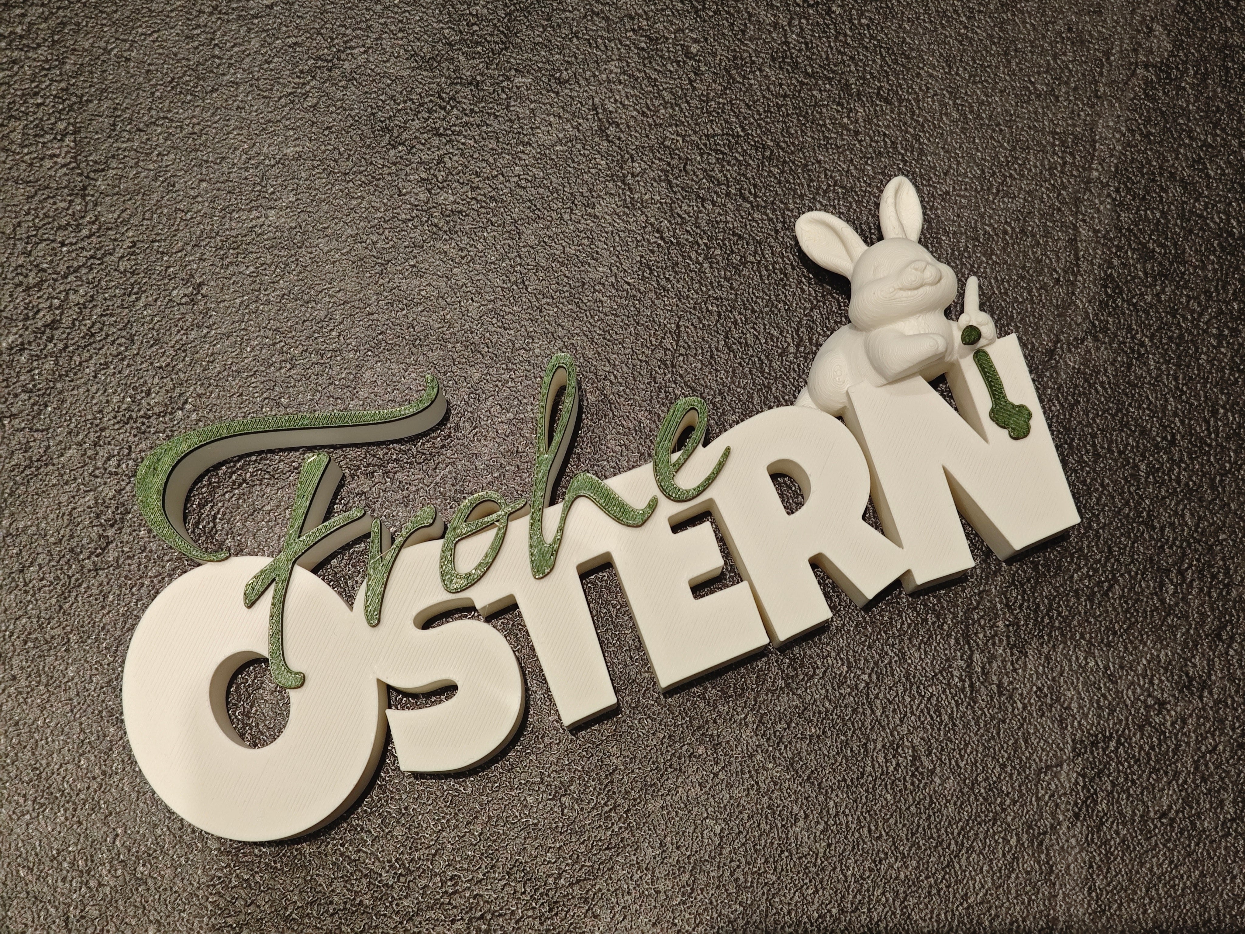 Schrift Frohe Ostern mit Hase weiss, grün